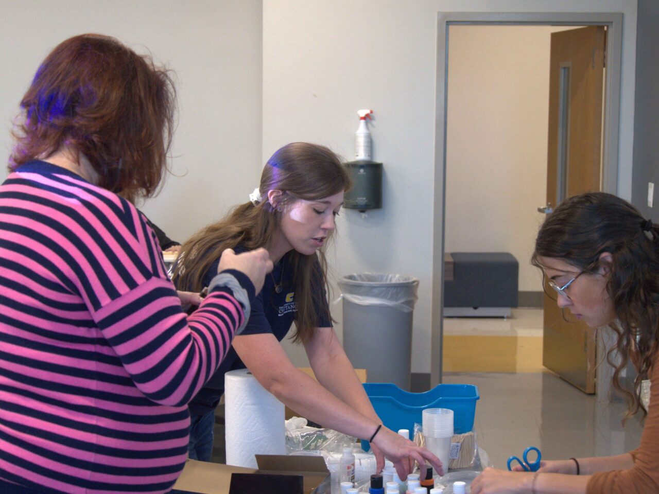 Dr. Katelyn Hancock, center, and students in the Ethics in Criminal Justice course participate in "Pouring for Purpose" on Nov. 5, 2024, in the 540 McCalllie Ave. Building.