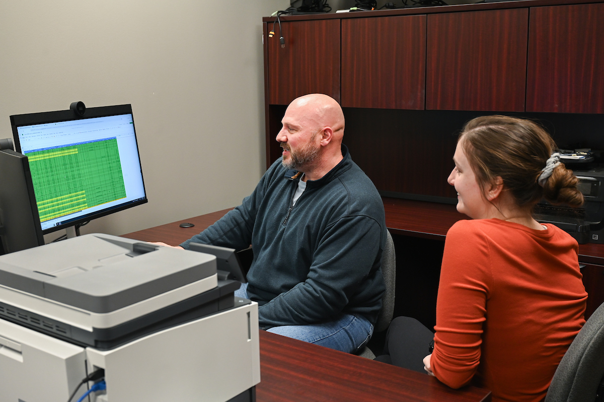 Dr. Rick Dierenfeldt, left, shown with graduate student Ellie Yates, spearheaded the creation of the Violence Reduction Initiative—a UTC research center designed to address violent crime in Chattanooga and beyond. Photo by Angela Foster.