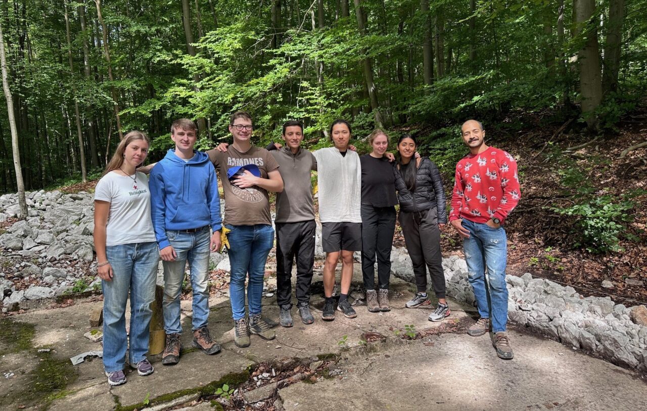 Stephen Scott (center, brown jacket) and Grace Allen (black shirt) with other members of their group at the Mittelbau-Dora museum. Photo courtesy of Grace Allen.