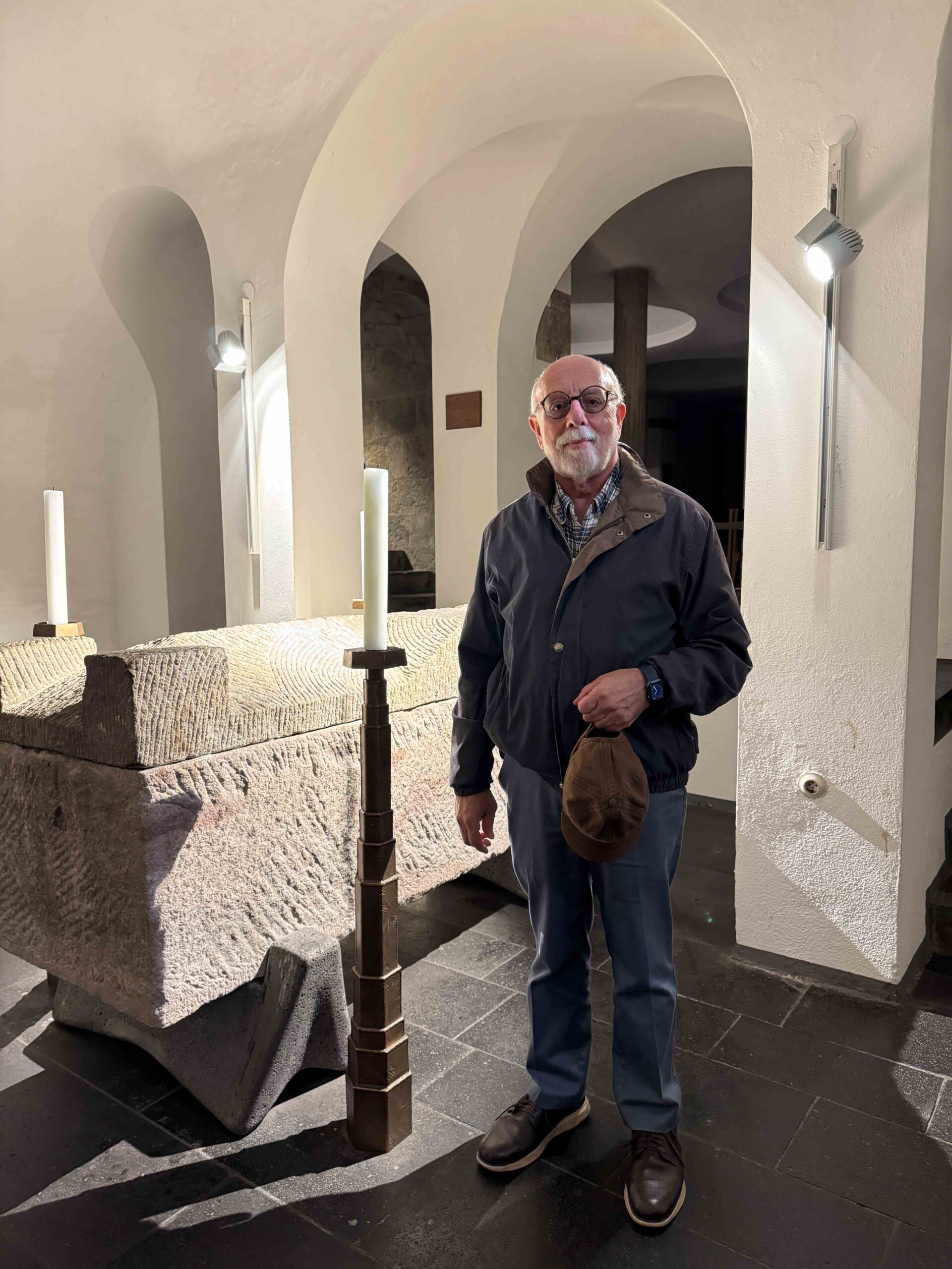 Dr. Irven Resnick stands in front of the sarcophagus of St. Albertus Magnus in the crypt of the 11th century Sankt Andreas Kirche in Cologne. Photo courtesy of Dr. Irven Resnick.
