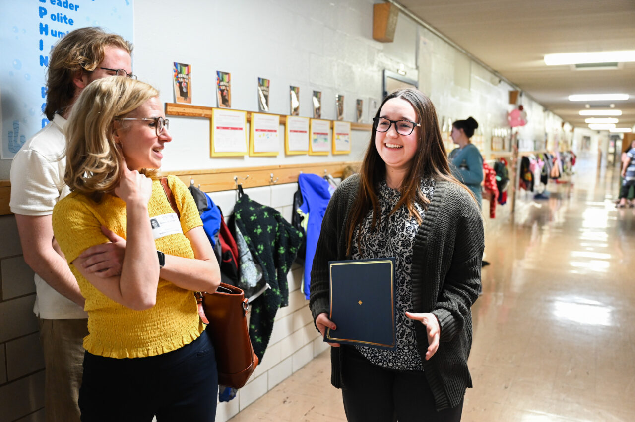 Music students and professor Alison Allerton deliver a $1000 check to Lauren Cardenas, music teacher and recent graduate, Friday, Feb. 28, 2025 at Dupont Elementary School.