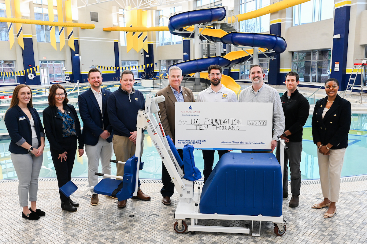 The chair lift unveiling at the UTC Aquatic and Recreation Center took place on Wednesday, Feb. 12, 2025. From left: Kate Dennis (Aquatics and Safety Coordinator), Daphne Kirksey (External Affairs Manager, Tennessee American Water), Ryan Jones (Senior Associate Athletics Director for Development), Brent Goldberg (Vice Chancellor for Finance and Administration), Grant Evitts (President, Tennessee American Water), Corbin Hedges (Associate Director for Campus Recreation), Aaron Grisham (Executive Director of University Center and Aquatic and Recreation Center), Trevor Yacopino (Maintenance Technician, Campus Recreation), Dr. Artanya Wesley (Vice Chancellor of Enrollment Management and Student Affairs). Photo by Angela Foster.