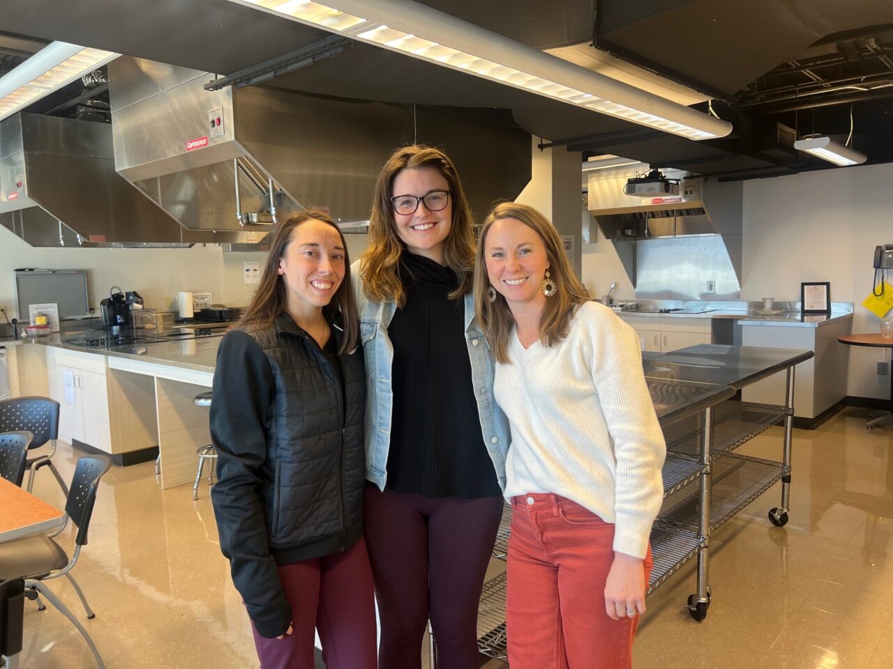 Brittany Rogers (left), Erica Carr and their instructor Emily Maddux in the nutrition lab in UTC's Metropolitan Building. 