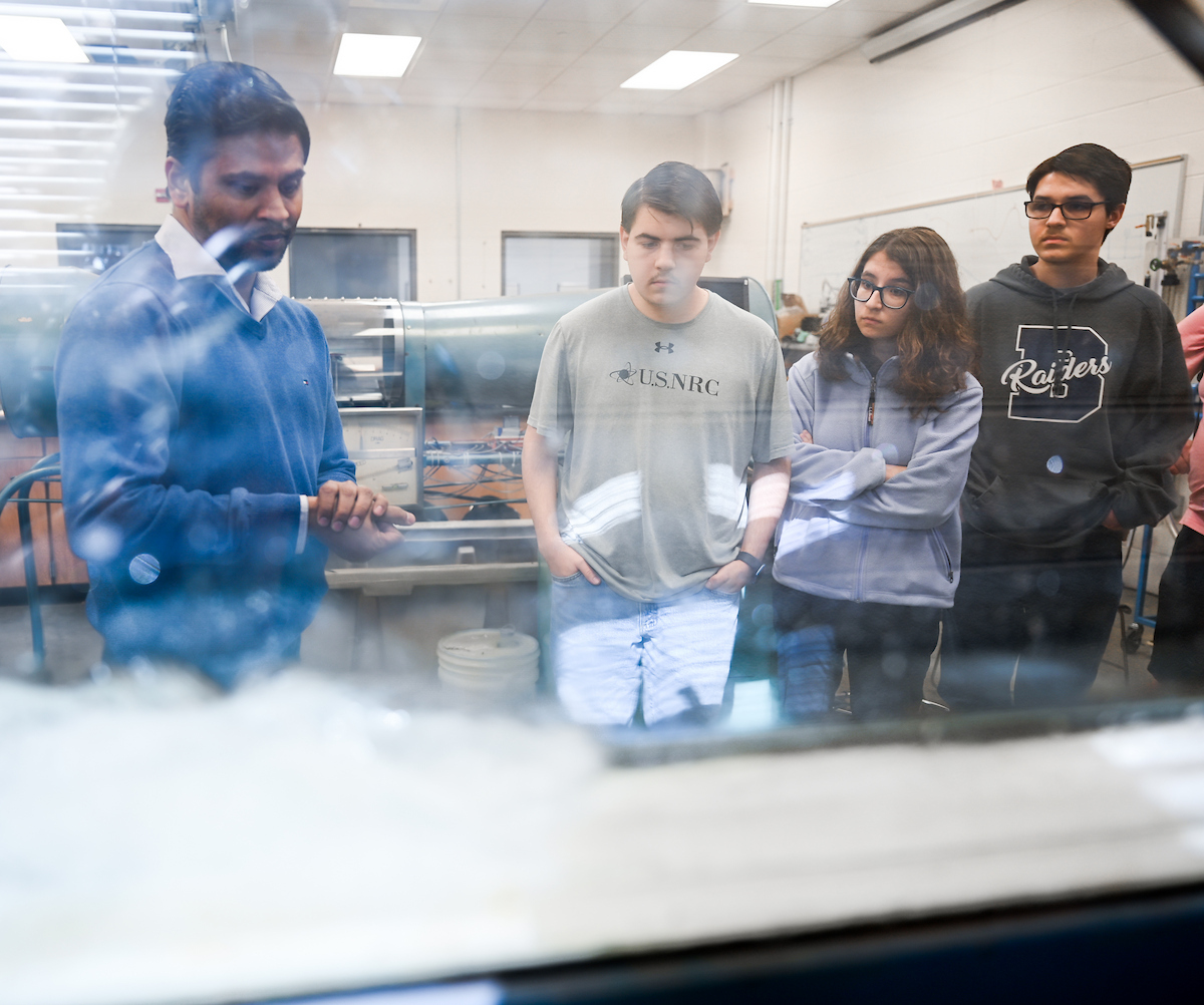 Isabella, Luke and Matthew Riggs work Tuesday, Feb. 25, 2025 in Reetesh Ranjan's fluids lab in the Engineering and Computer Science building. Matthew, taller, glasses, dark sweatshirt Luke, USNRC gray shirt, no glasses