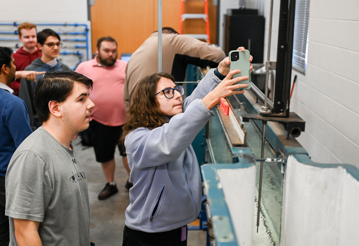Isabella, Luke and Matthew Riggs work Tuesday, Feb. 25, 2025 in Reetesh Ranjan's fluids lab in the Engineering and Computer Science building. Matthew, taller, glasses, dark sweatshirt Luke, USNRC gray shirt, no glasses
