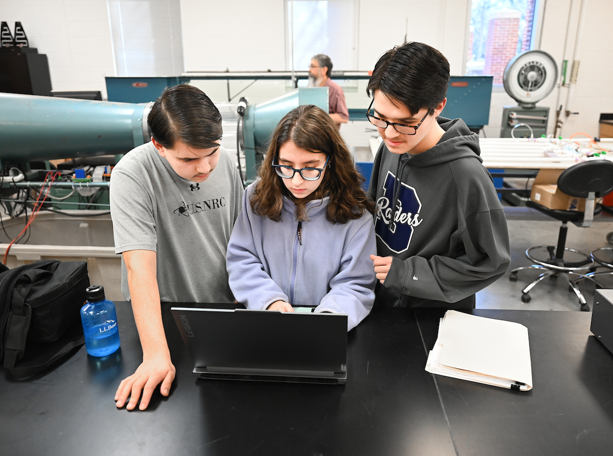 Isabella, Luke and Matthew Riggs work Tuesday, Feb. 25, 2025 in Reetesh Ranjan's fluids lab in the Engineering and Computer Science building. Matthew, taller, glasses, dark sweatshirt Luke, USNRC gray shirt, no glasses