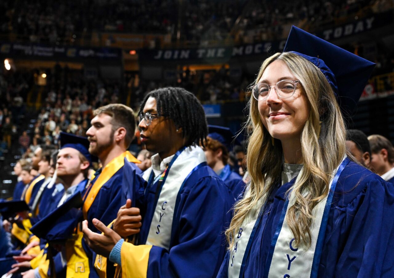 Cecily Holland crossed the McKenzie Arena stage Dec. 14, 2024, receiving a Bachelor of Applied Science in Information Technology in Cybersecurity degree. Photo by Angela Foster.