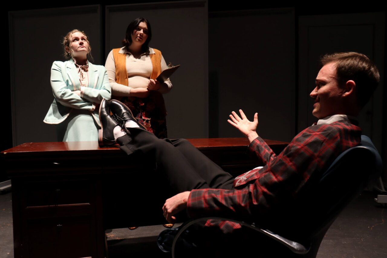 Pearson Smith (as Judy Bernly), left, Katie Mullins (as Violet Newstead) and Harrison Faulkner (as Franklin Hart Jr.) in the February 2024 UTC Theatre Co. production of “9 to 5 the Musical.” Photo courtesy of UTC Theatre Co.