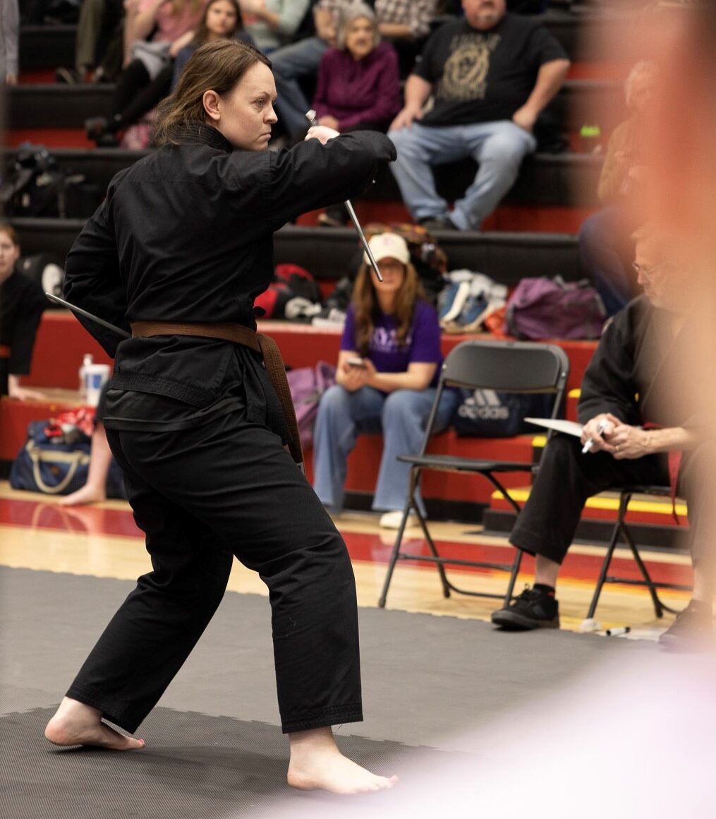UTC Karate Club assistant instructor Meagan Matthews flips the sais (photo credit: Bryan College).