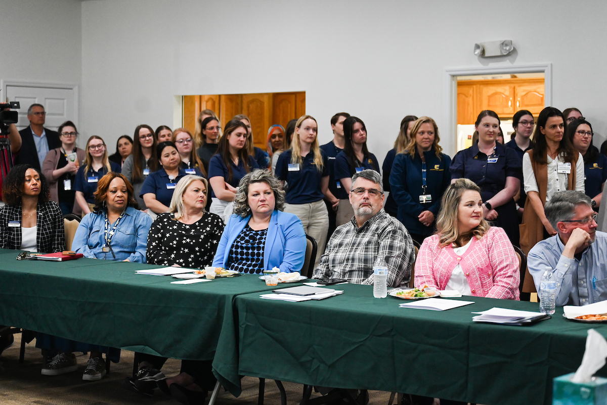 UTC faculty, staff and students, along with elected officials, attend the ribbon cutting for the Mobile Moc clinic Tuesday, Mar. 25, 2025 at the Rhea County Welcome Center.