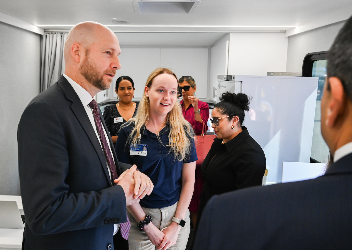 UTC faculty, staff and students, along with elected officials, attend the ribbon cutting for the Mobile Moc clinic Tuesday, Mar. 25, 2025 at the Rhea County Welcome Center.