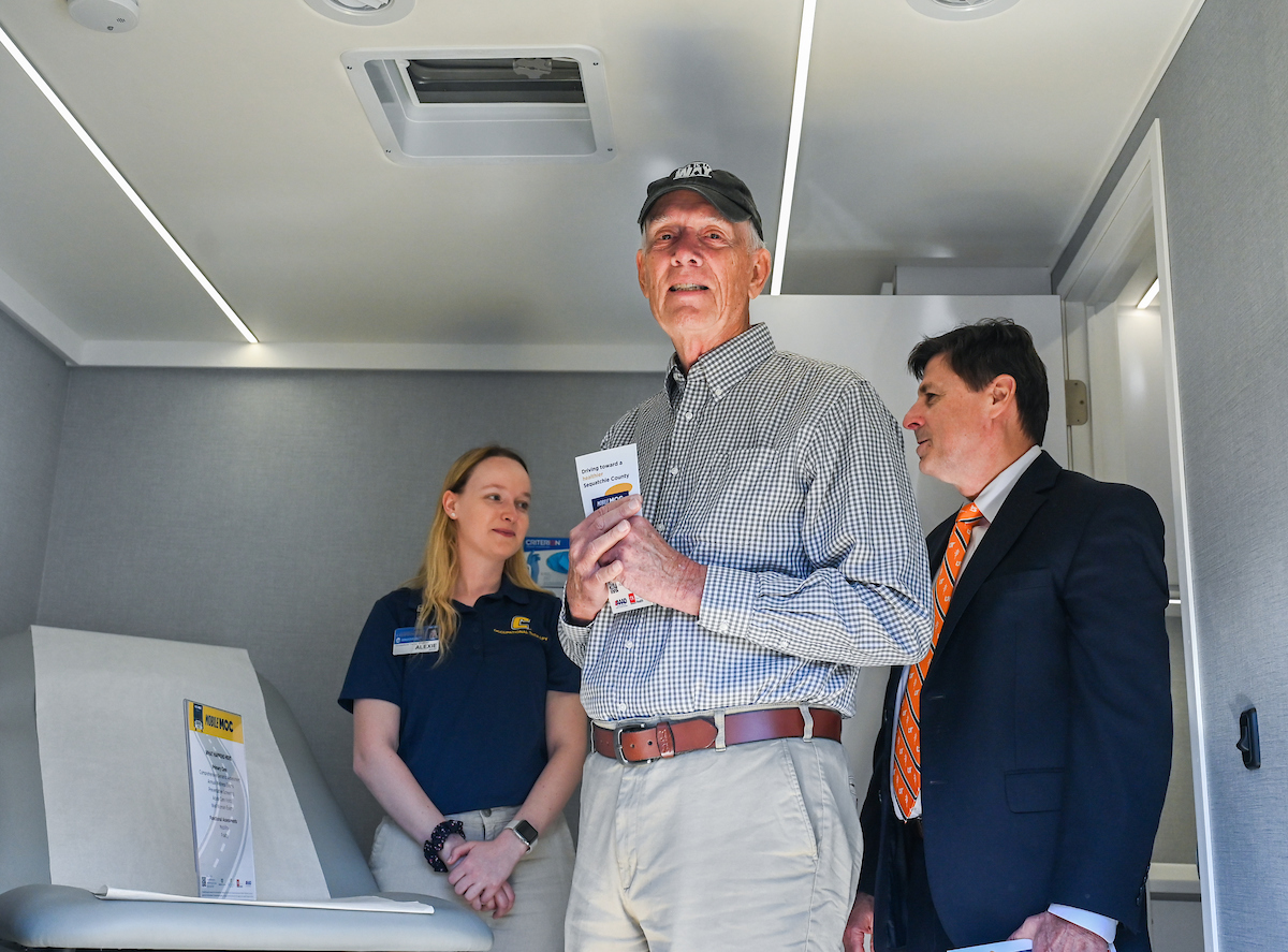 UTC faculty, staff and students, along with elected officials, attend the ribbon cutting for the Mobile Moc clinic Tuesday, Mar. 25, 2025 at the Rhea County Welcome Center.