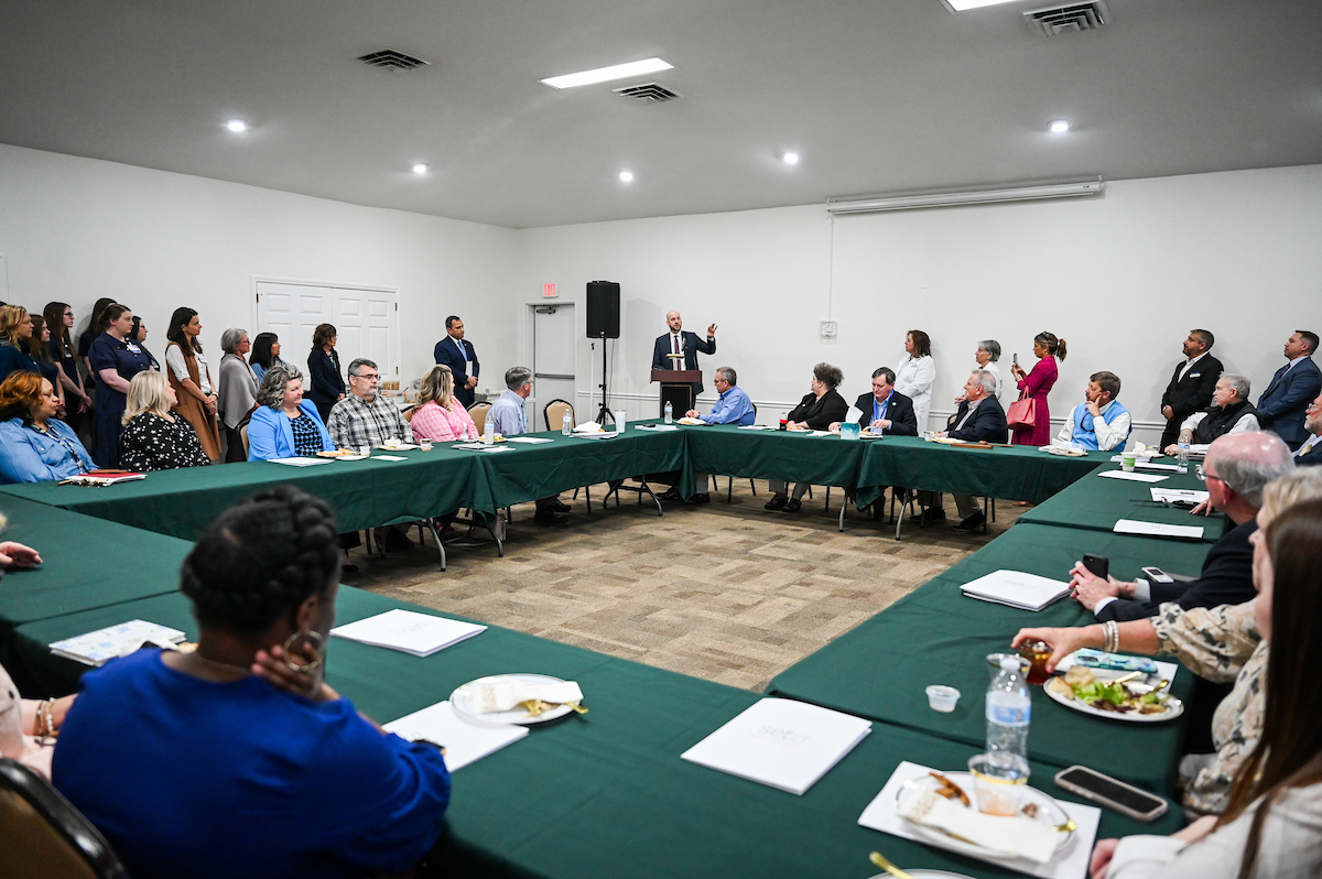 UTC faculty, staff and students, along with elected officials, attend the ribbon cutting for the Mobile Moc clinic Tuesday, Mar. 25, 2025 at the Rhea County Welcome Center.