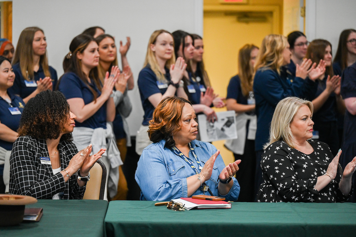 UTC faculty, staff and students, along with elected officials, attend the ribbon cutting for the Mobile Moc clinic Tuesday, Mar. 25, 2025 at the Rhea County Welcome Center.