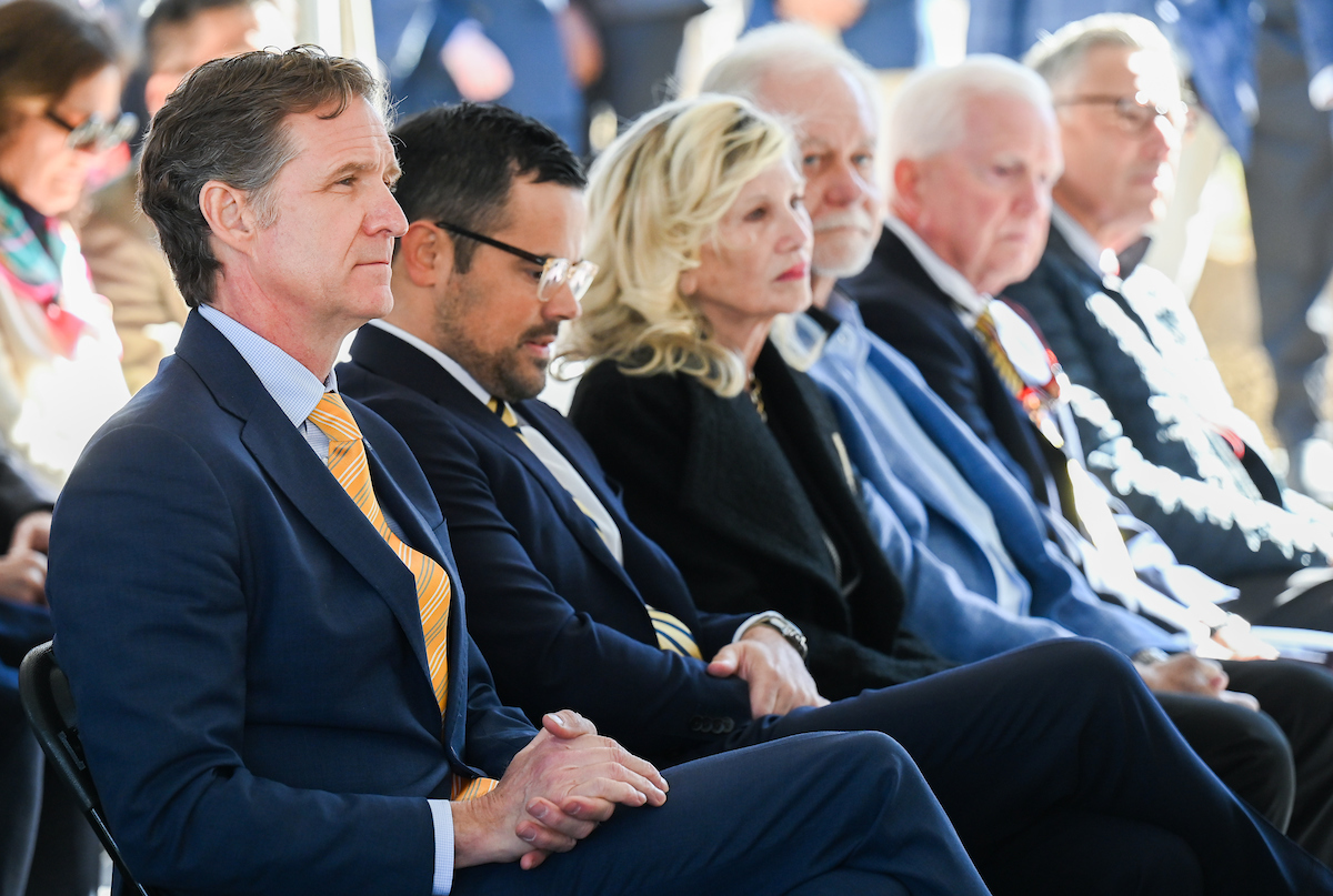 Officials attend a groundbreaking ceremony Monday, Mar. 3, 2025 for the addition to the Gary W. Rollins Business school.