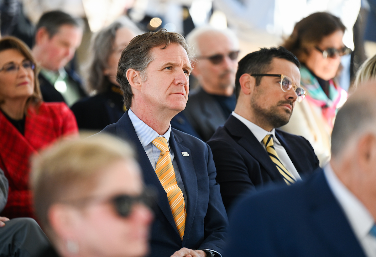 Officials attend a groundbreaking ceremony Monday, Mar. 3, 2025 for the addition to the Gary W. Rollins Business school.