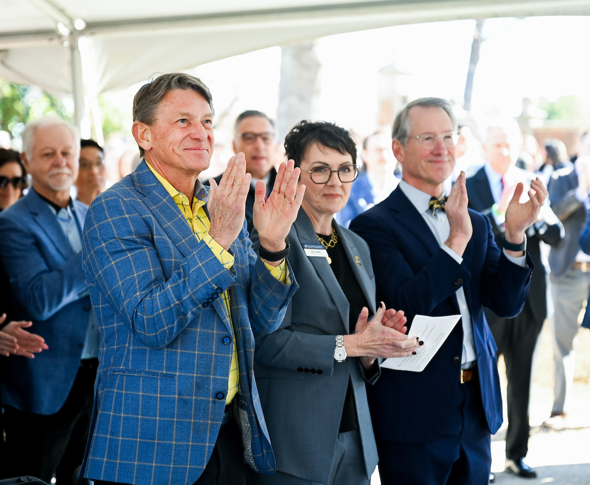 Officials attend a groundbreaking ceremony Monday, Mar. 3, 2025 for the addition to the Gary W. Rollins Business school.