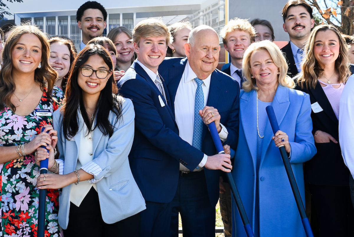 Officials attend a groundbreaking ceremony Monday, Mar. 3, 2025 for the addition to the Gary W. Rollins Business school.