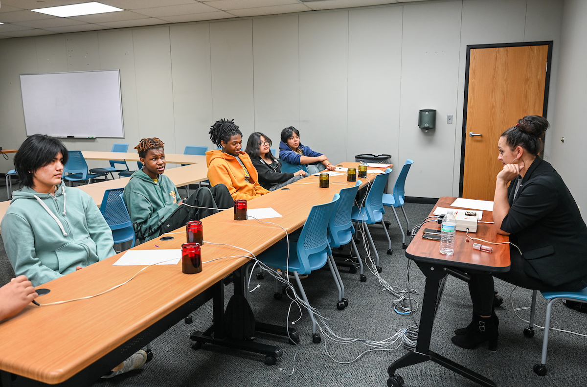 Education specialist Kristina McClure, right works with high school students in the Upward Bound Math Science program. Photo by Angela Foster.