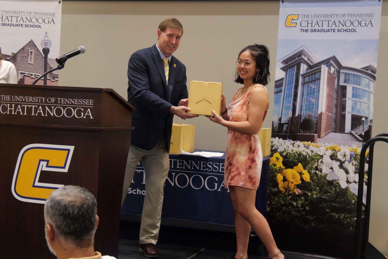 Andrea Stevens receives the Outstanding Master’s Student Award for the Chemical Engineering graduate program from Dr. Ethan Carver, associate provost and dean of the Graduate School, at the annual Outstanding Graduate Student Celebration on Friday, April 11. Photo courtesy of Philip Sparn.