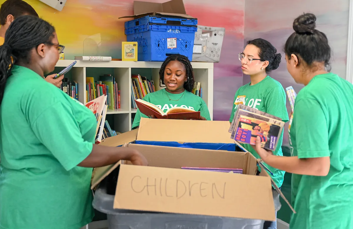 Chello Gardner (middle) and other UTC student volunteers at CHATT Foundation during United Way's Day of Caring.