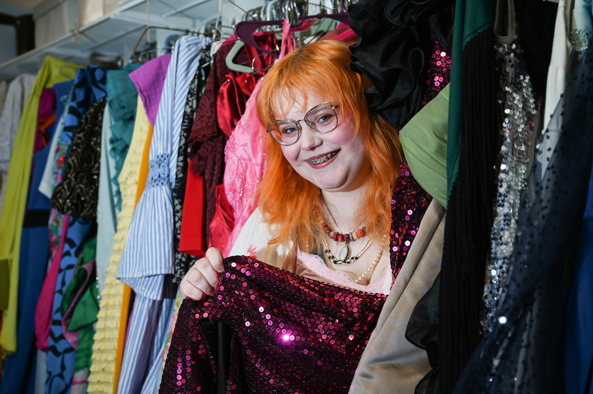 University High senior Shi Mae Bowling, standing in the Department of Theatre's costume shop, will be a first-year UTC student this fall. Photo by Angela Foster.