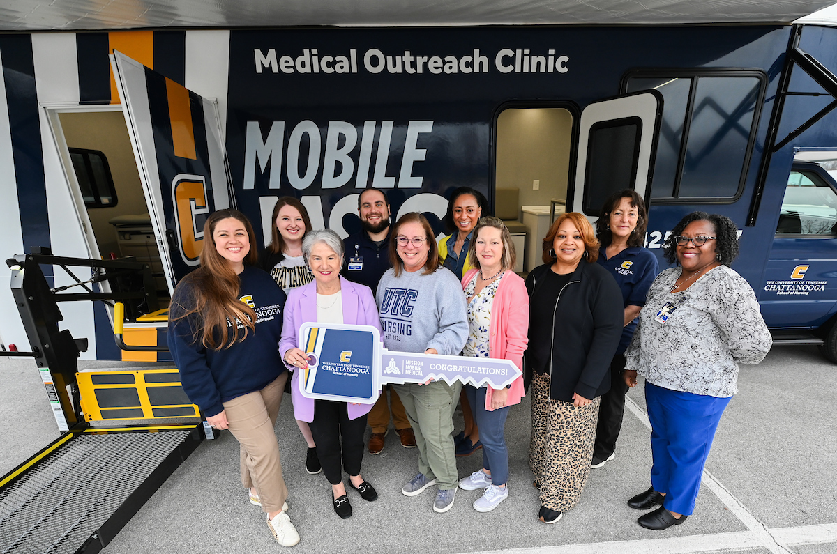 Lori Coletta (second from right) and members of the MobileMOC team at the March 13 event celebrating the vehicle's arrival. Photo by Angela Foster.