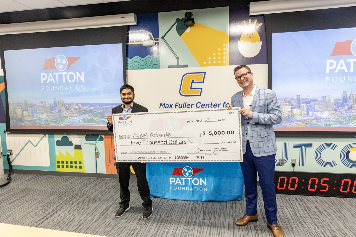 Rizwaan Abdulkadir (left) poses with Spencer Patton after receiving the top prize for his business "Parleii." Photo by Flint Chaney.