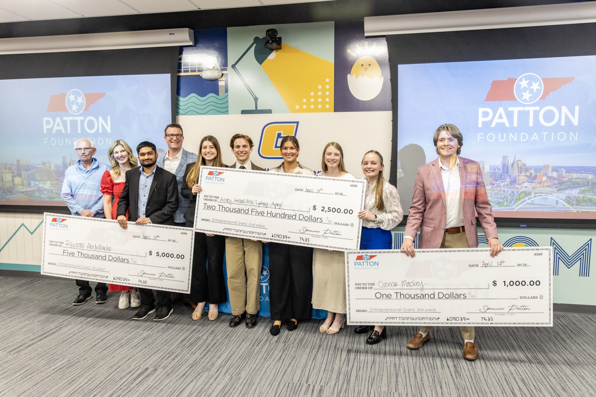 Fly! Mocs Business Pitch Competition winners received checks for their business pitch ideas. Photo by Flint Chaney.