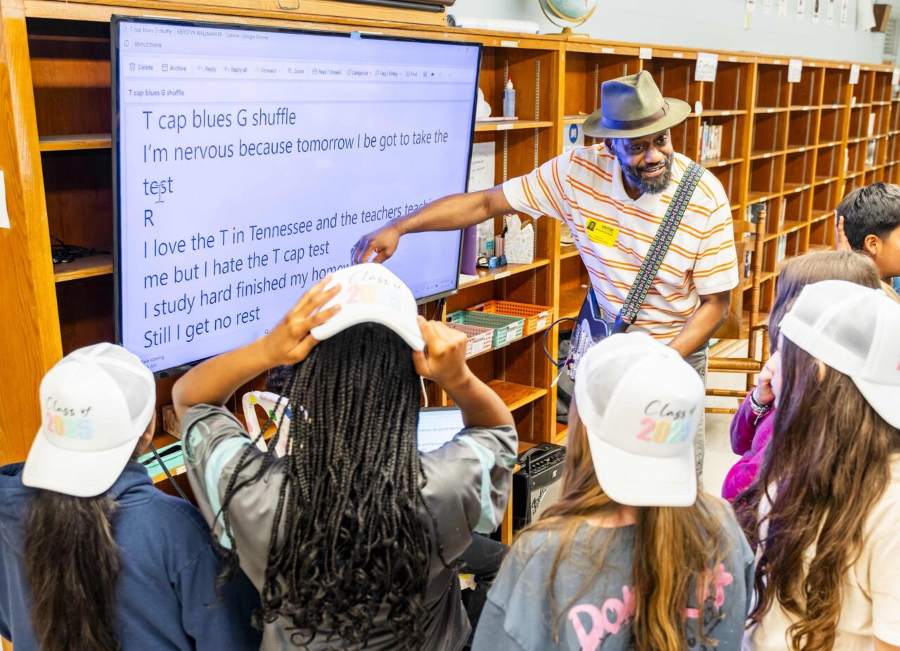 Rick Rushing III works with Hixson Elementary School fifth graders on their lyrics. Photo courtesy of Arts-Based Collaborative.