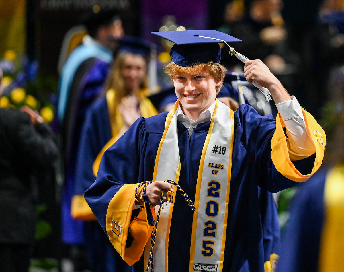 Communications major Trevor Jolley walks back from the stage during the first of two undergraduate ceremonies Saturday, May 3, 2025 in McKenzie Arena at the University of Tennessee at Chattanooga.