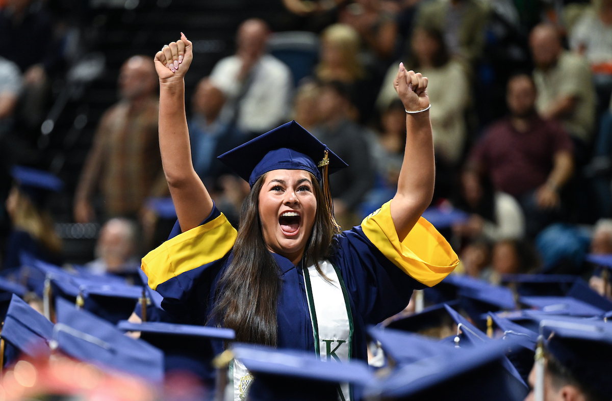Hannah Weis celebrates on the way back to her seat during the first of two undergraduate ceremonies Saturday, May 3, 2025 in McKenzie Arena at the University of Tennessee at Chattanooga.