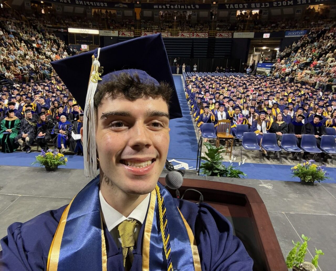 SGA President Jordan Fall, who graduated with a bachelor's degree in marketing, took a selfie from the McKenzie Arena podium after offering congratulations to the graduates.