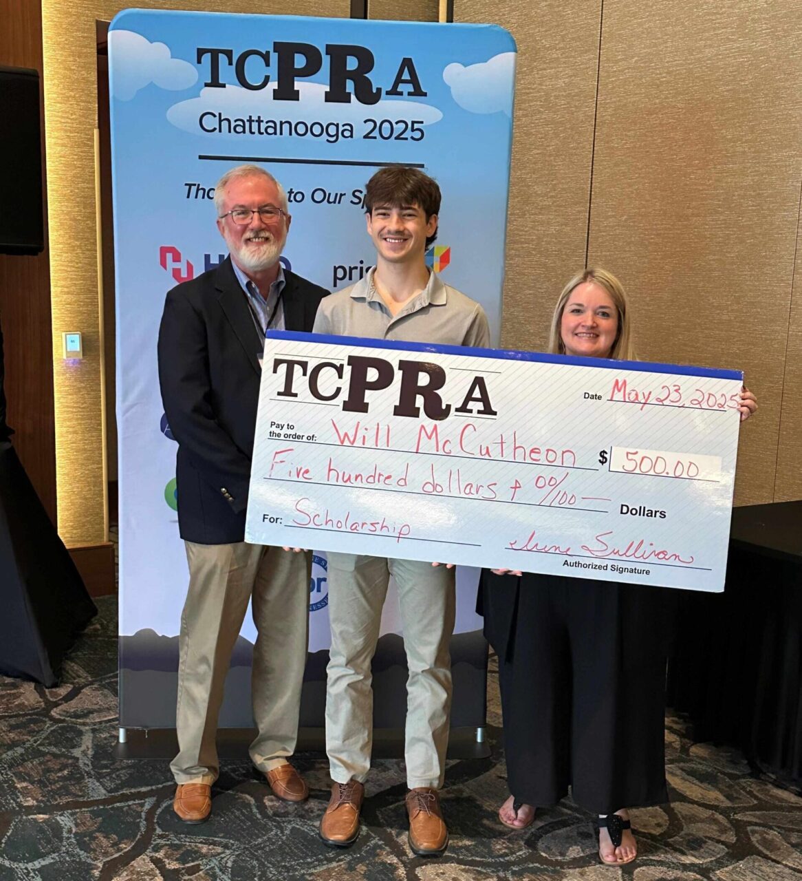 UTC Executive Video Producer Mike Andrews, left, student videographer Will McCutcheon and TCPRA President Bobbie Maynard.