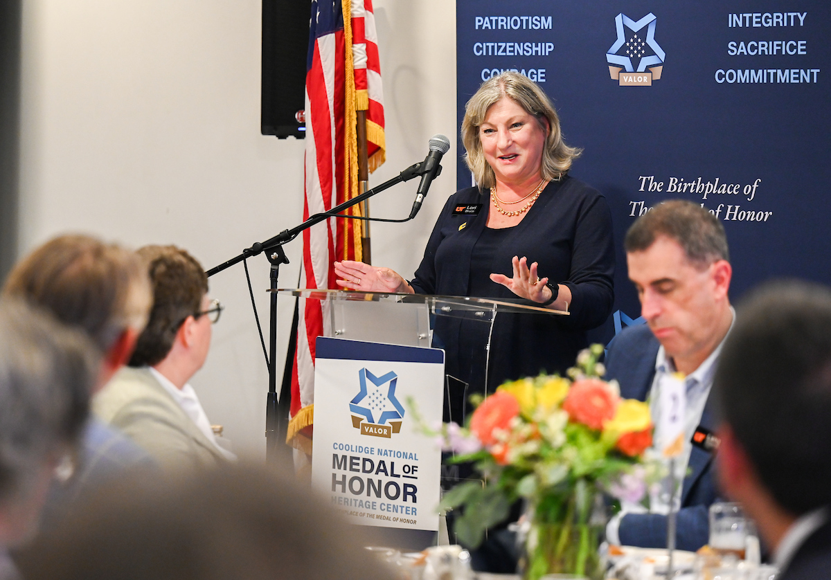 People mingle during the Board of Trustees dinner Monday, June 30 at the Medal of Honor Museum.