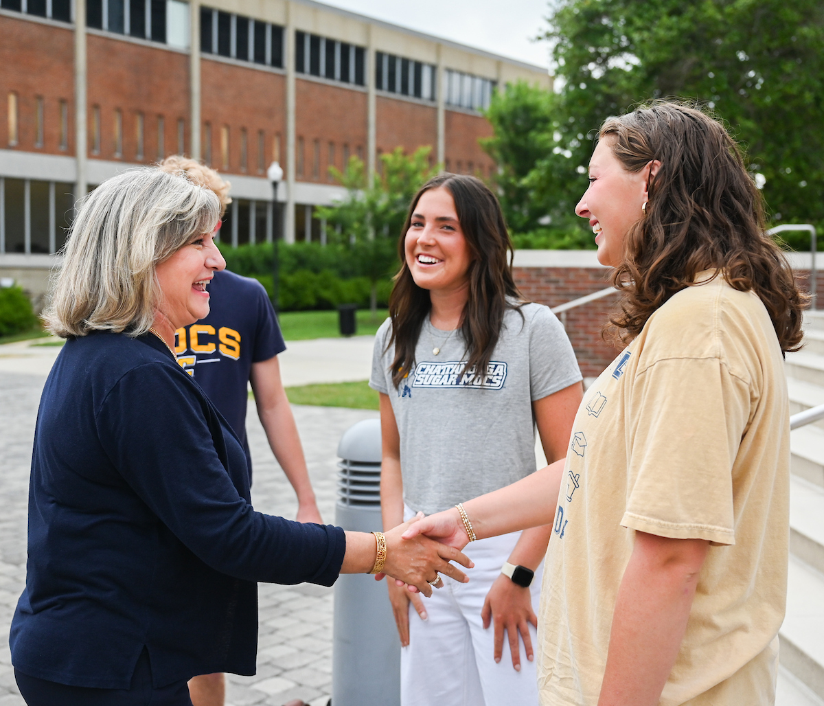 Chancellor Lori Bruce begins her first day, Monday, June 30. Bruce walked from West Campus housing to her office, with quick stops to meet students, and was greeted by vice chancellors when she arrived at Founders Hall.