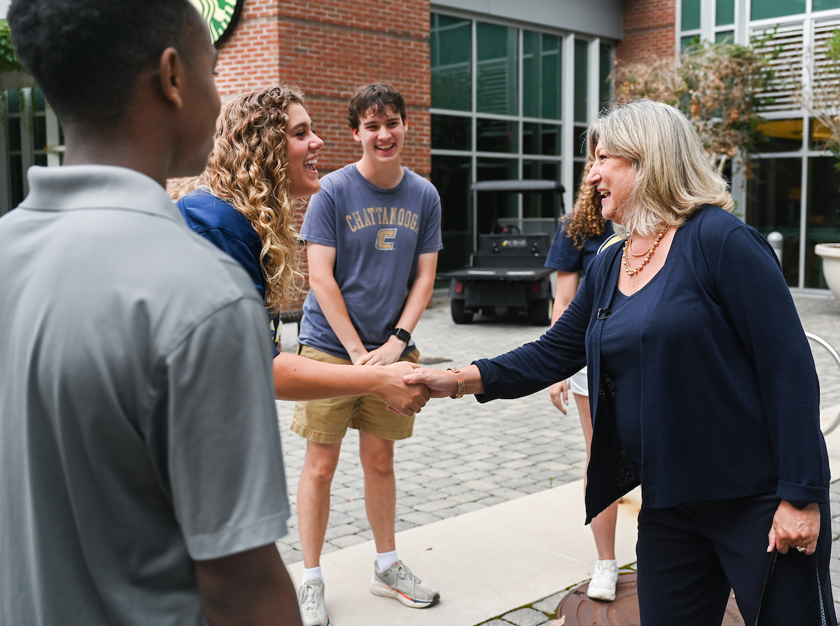Chancellor Lori Bruce begins her first day, Monday, June 30. Bruce walked from West Campus housing to her office, with quick stops to meet students, and was greeted by vice chancellors when she arrived at Founders Hall.