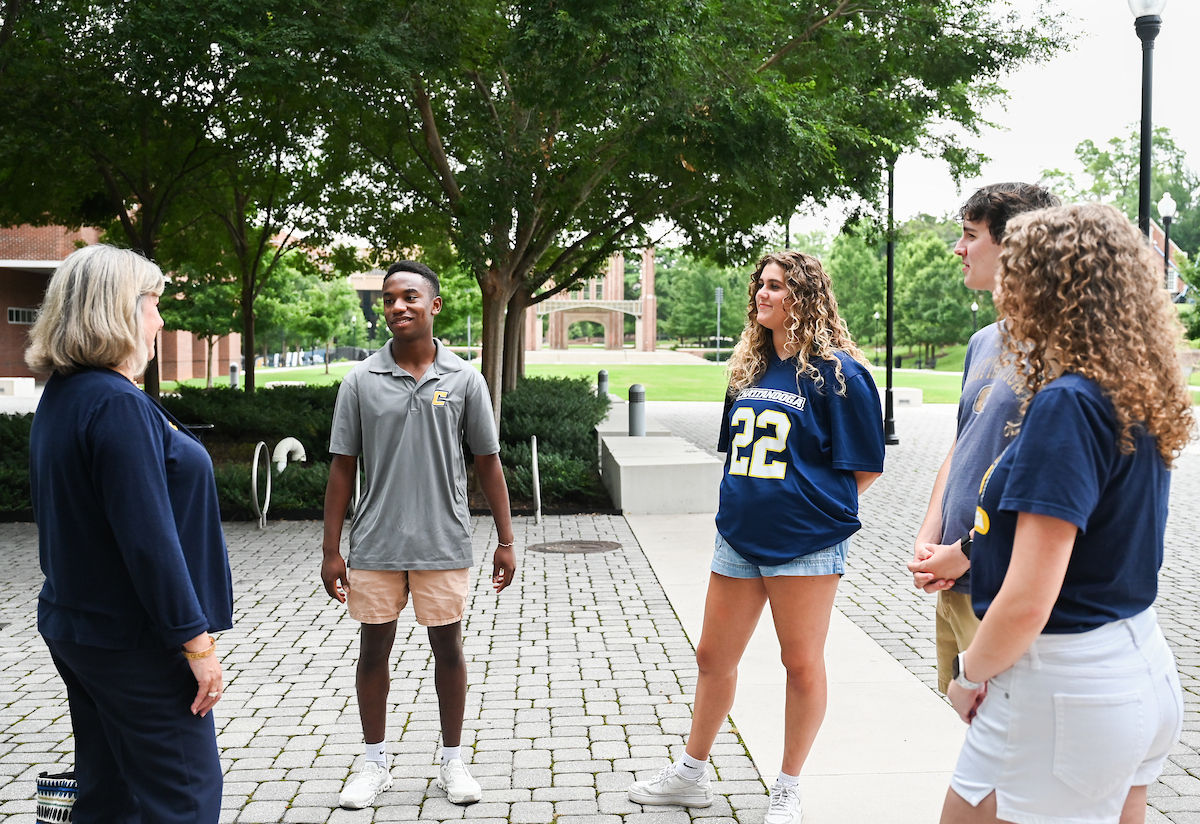 Chancellor Lori Bruce begins her first day, Monday, June 30. Bruce walked from West Campus housing to her office, with quick stops to meet students, and was greeted by vice chancellors when she arrived at Founders Hall.