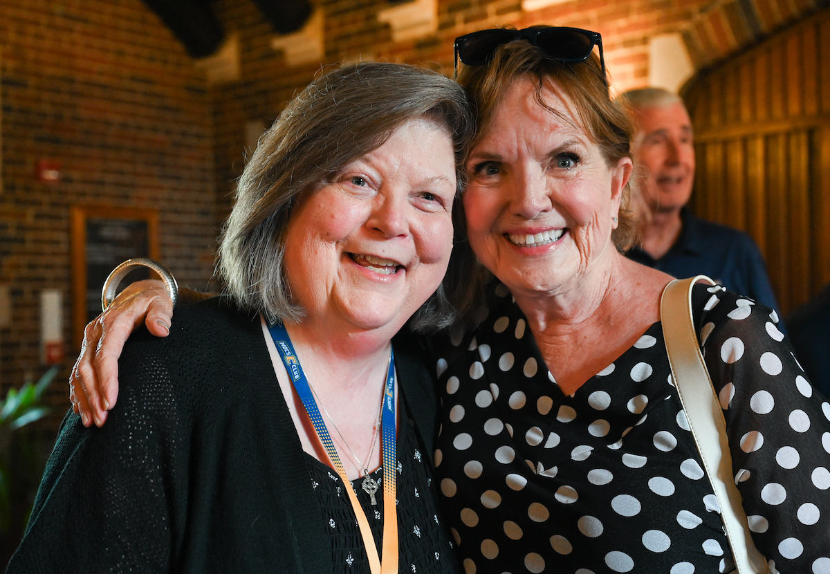 Teresa McKinney spent 20 years working for Dr. Mary Poston Tanner, watching her supervisor rise from department head to dean of the College of Health, Education and Professional Studies. The two recently reunited at a Founders Hall retirement reception for McKinney on June 11. Photo by Angela Foster.