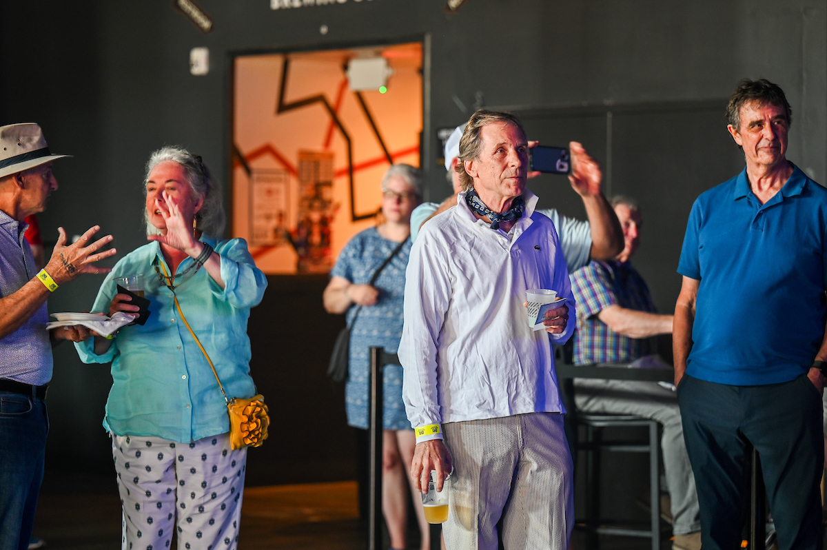People attend a WUTC fundraiser Sunday, June 22, 2025 at Barrelhouse Ballroom to honor Richard Windham, who is retiring after 40 years.