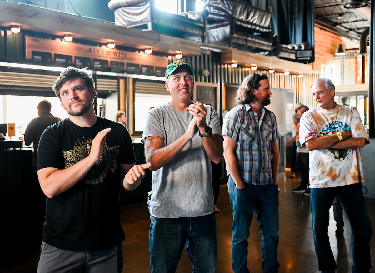People attend a WUTC fundraiser Sunday, June 22, 2025 at Barrelhouse Ballroom to honor Richard Windham, who is retiring after 40 years.