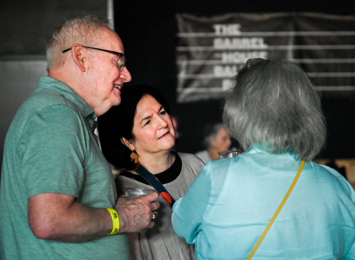 People attend a WUTC fundraiser Sunday, June 22, 2025 at Barrelhouse Ballroom to honor Richard Windham, who is retiring after 40 years.
