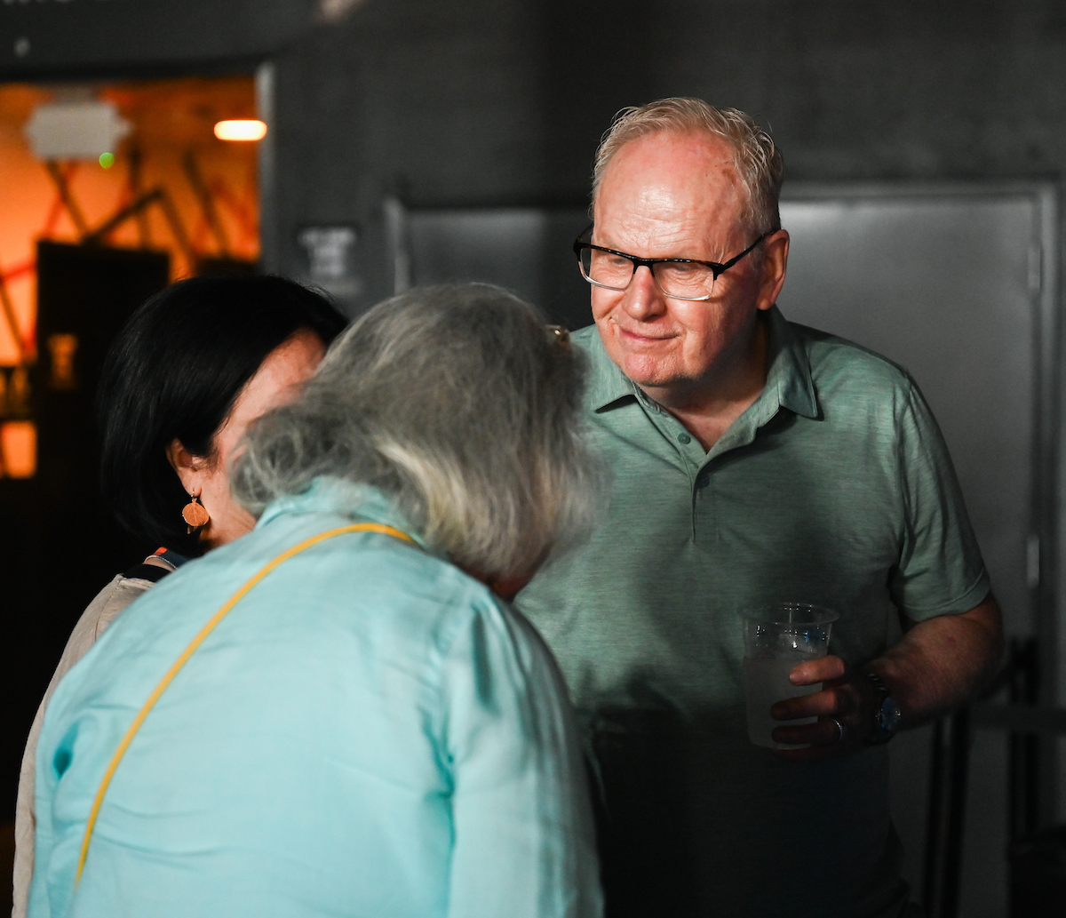 People attend a WUTC fundraiser Sunday, June 22, 2025 at Barrelhouse Ballroom to honor Richard Windham, who is retiring after 40 years.
