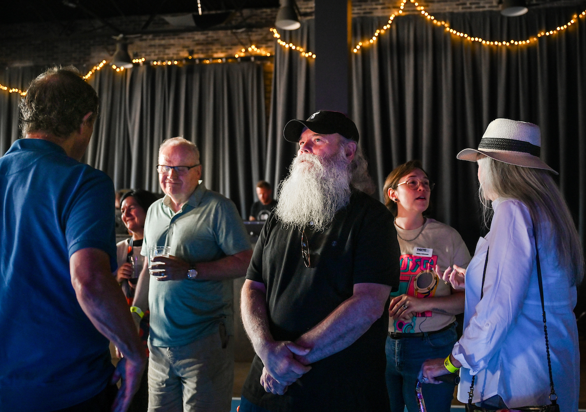 People attend a WUTC fundraiser Sunday, June 22, 2025 at Barrelhouse Ballroom to honor Richard Windham, who is retiring after 40 years.