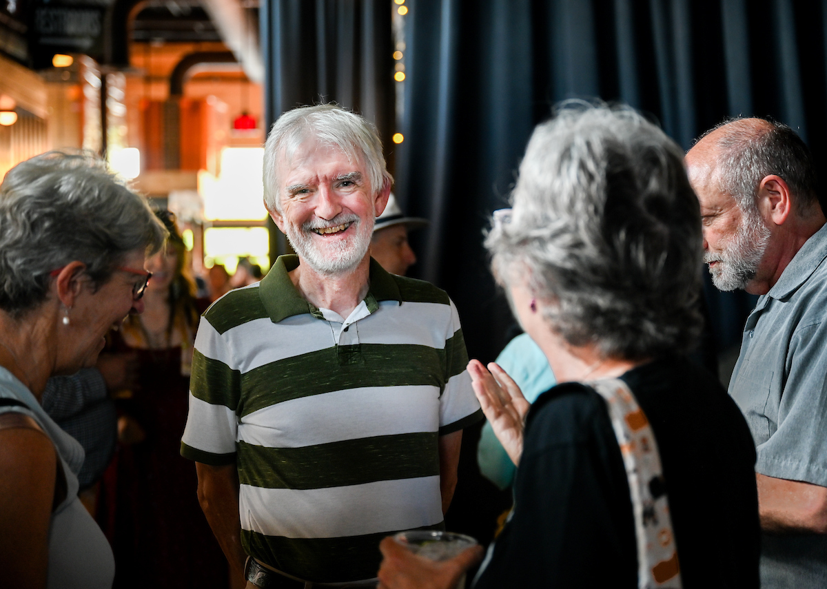 People attend a WUTC fundraiser Sunday, June 22, 2025 at Barrelhouse Ballroom to honor Richard Windham, who is retiring after 40 years.