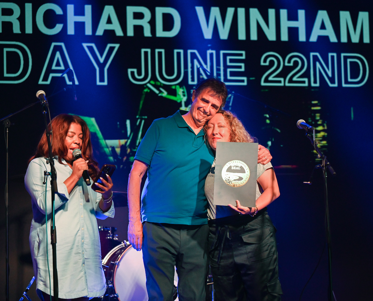 People attend a WUTC fundraiser Sunday, June 22, 2025 at Barrelhouse Ballroom to honor Richard Windham, who is retiring after 40 years.