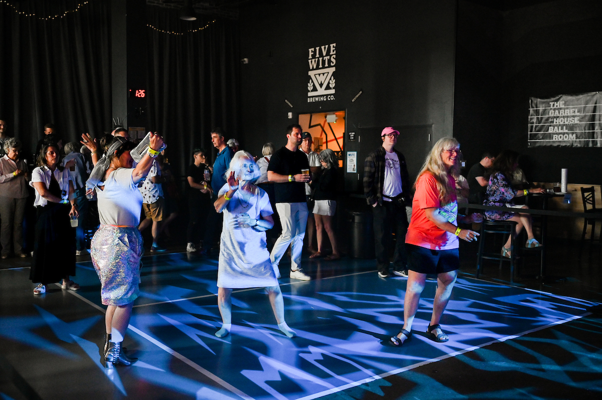 People attend a WUTC fundraiser Sunday, June 22, 2025 at Barrelhouse Ballroom to honor Richard Windham, who is retiring after 40 years.