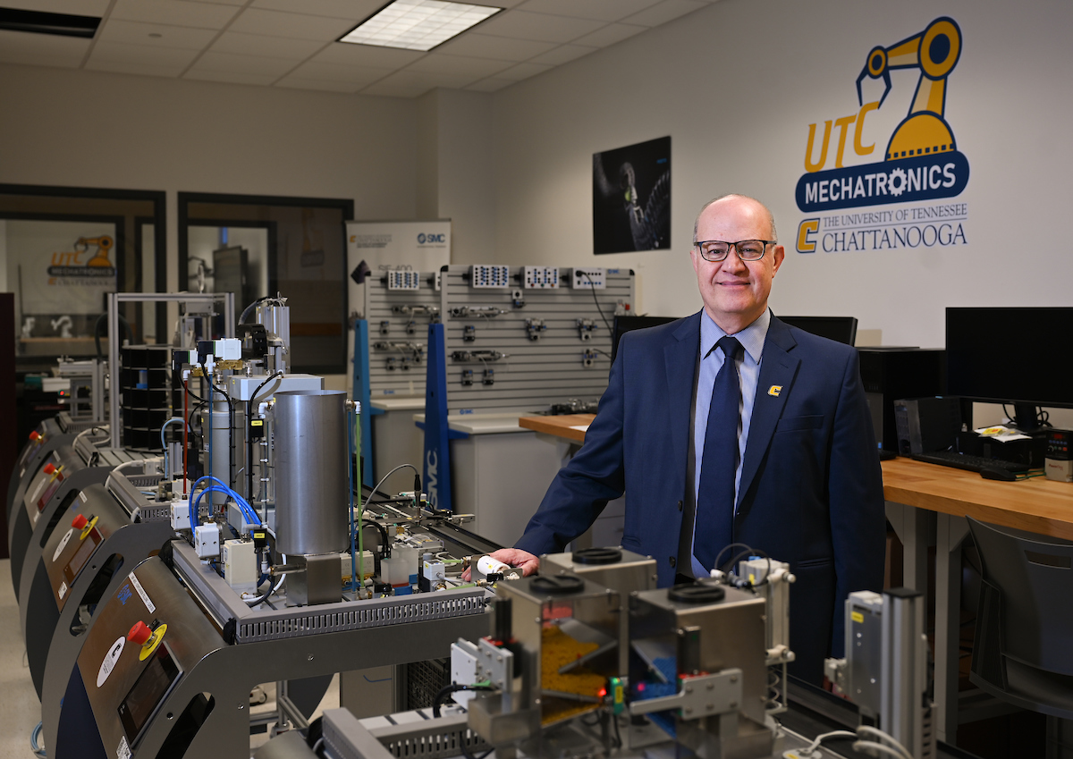 Dr. Ahad Nasab stands in the College of Engineering and Computer Science’s mechatronics lab. 