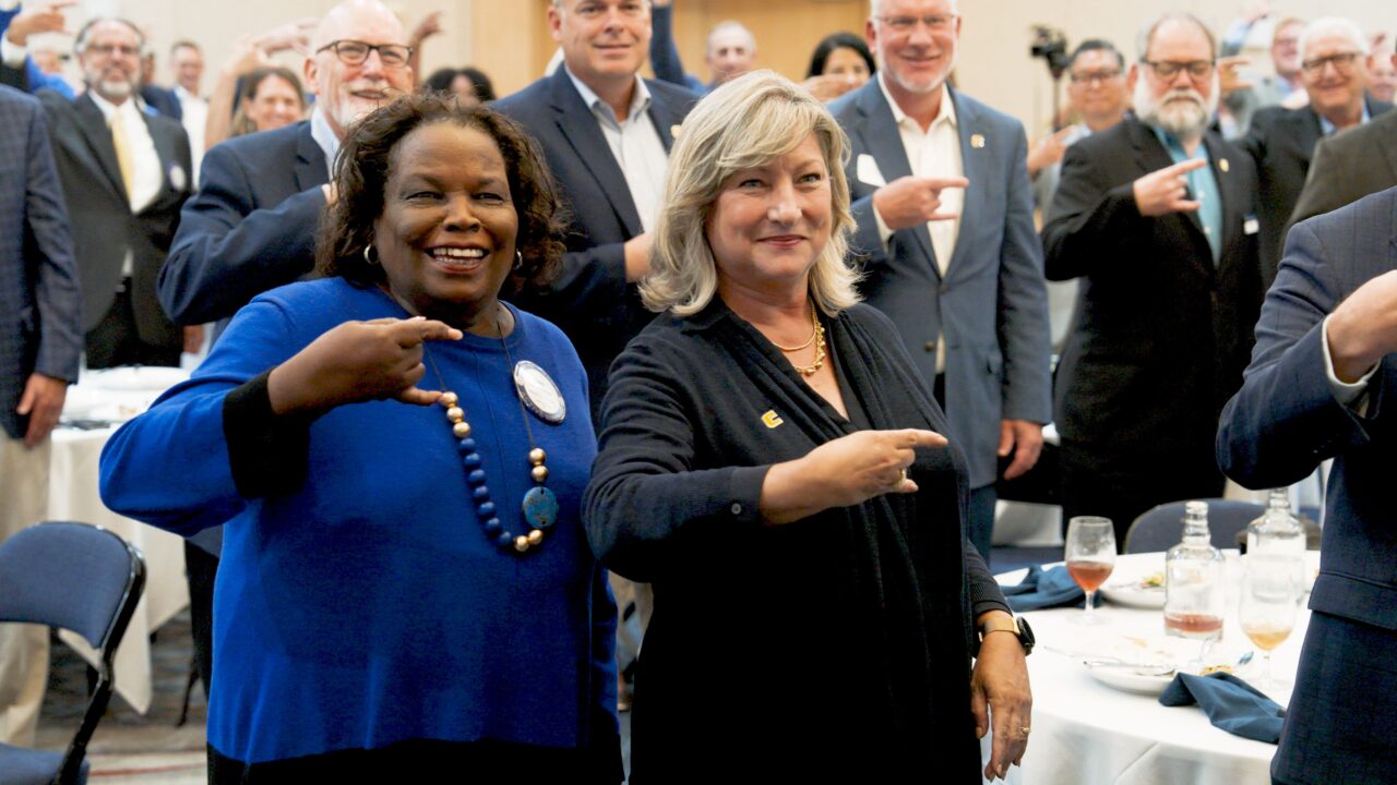 Chattanooga Rotary Club President Edna Varner and Chancellor Lori Bruce helped show off a "Power C" at the July 17, 2025, Rotary Club meeting. Photo by Sam Blevins.