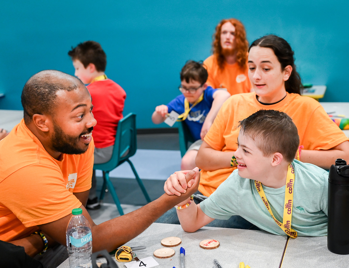 Psychology students work with Friends Discovery Camp campers Thursday, June 12, 2025 at the Creative Discovery Museum.